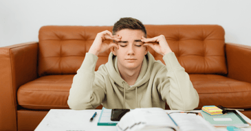 stressed out college student worrying about managing back to school transition