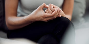 worried hands gripping