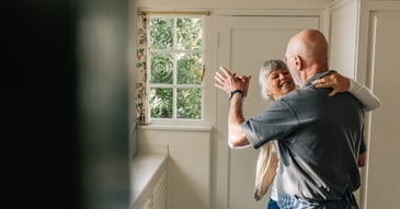 couple in  EFT counseling doing tango in kitchen 