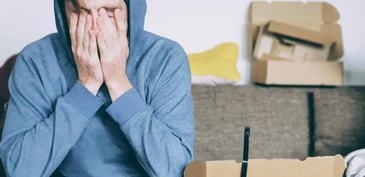 hooded man crying