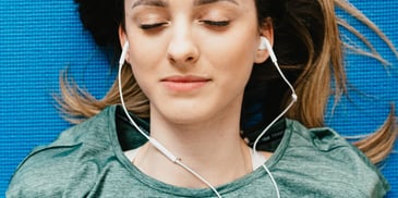 Lady enjoying a music through her headphone