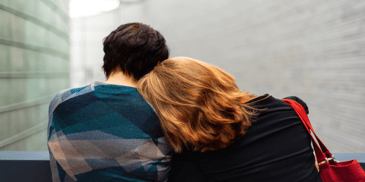 woman leaning in his man's shoulder