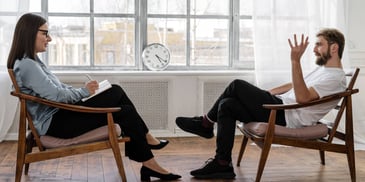 man talking with a therapist