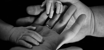 hands of a mother and her child