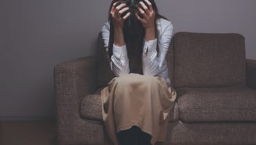 distressed woman sitting