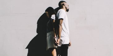 2 couples holding their hands