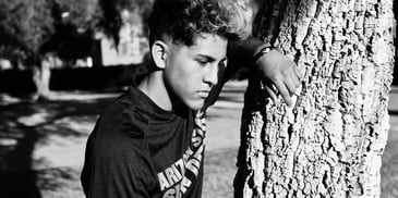 A man beside a tree