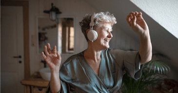 old woman enjoying music