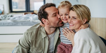 Newton family with small child hugging in therapy at Lifeologie