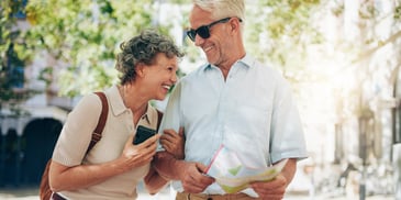 Over-65 gray couple leaning in toward each other