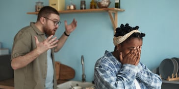 Frustrated couple arguing in the kitchen