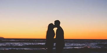 A couple affectionately kissing each other