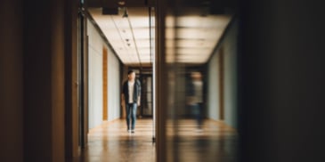 man with his reflection on the wall