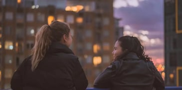 2 women staring at one another