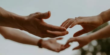 Hands touching each other