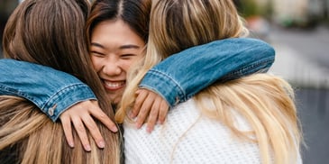 teen girl hugging self esteem support group friends