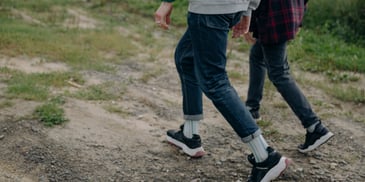 2 sets of legs on hiking trail during walk and talk therapy