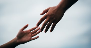 couples' hands reaching out for support