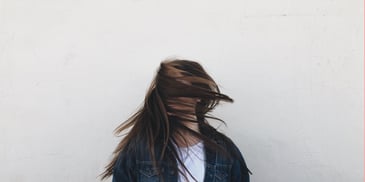 woman flexing her hair