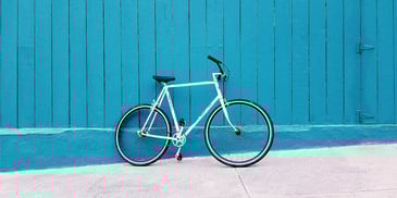 a bike beside a blue wall