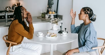 couple disagreeing about boundaries and communication at breakfast table