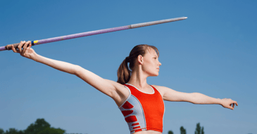 A woman about to throw a javelin