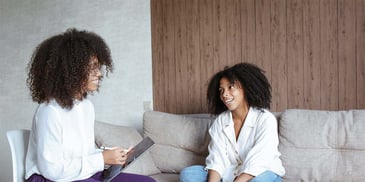 A woman speaking with her therapist