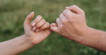 left and right hands cooperating and clasping in agreement