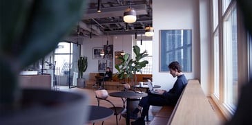 Person sitting in coffee shop. Photo by <a href=